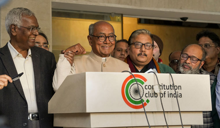 Congress MP Digvijaya Singh with CPI leader D. Raja and RJD MP Manoj Kumar Jha during a press conference after a meeting of opposition parties in Delhi | PTI