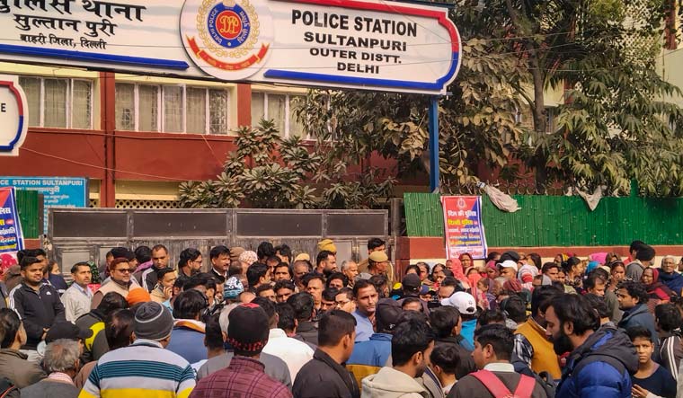 People gathered outside the Sultanpuri police station demanding stern action against the five men accused in the road accident | PTI