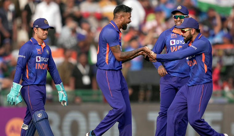 Hardik Pandya with teammates celebrates the wicket of New Zealand's Mitchell Santner | PTI