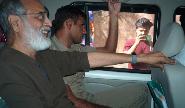 Founder and Editor-in-Chief of NewsClick Prabir Purkayastha being brought to Delhi Police Special Cell in New Delhi | AP