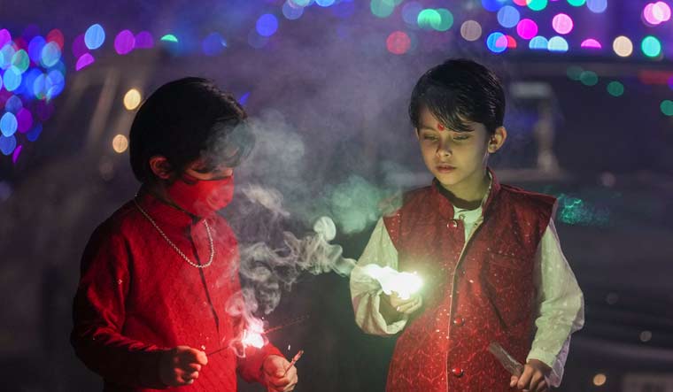 Children celebrate Diwali in New Delhi | PTI
