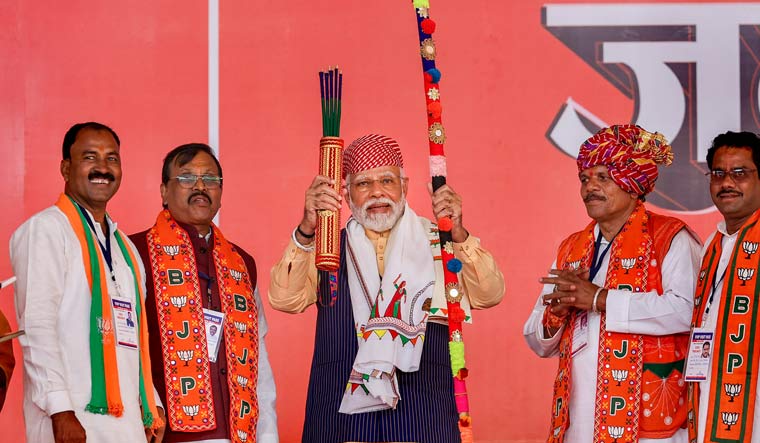 Prime Minister Narendra Modi being felicitated during a public meeting in Jhabua | PTI