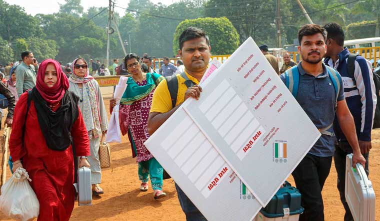 Polling officials with EVMs and other election material leave for poll duty ahead of Madhya Pradesh Assembly elections, in Bhopal | PTI