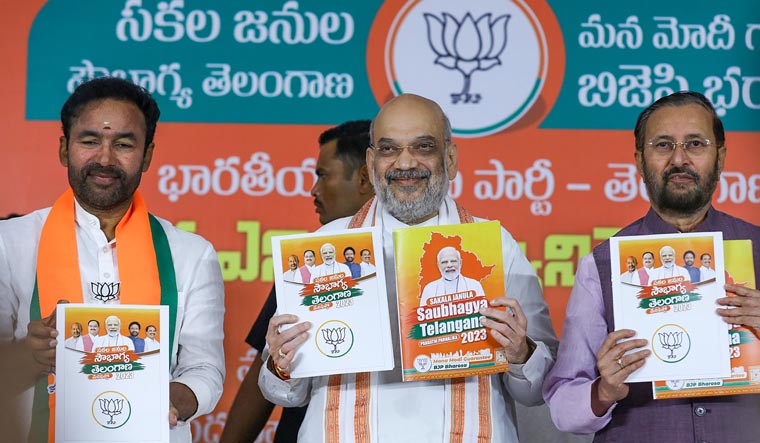 Union Home Minister Amit Shah with Union Minister and Telangana BJP President G. Kishan Reddy and party leader Prakash Javadekar releases the party's manifesto for the Telangana Assembly elections, in Hyderabad | PTI