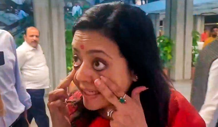 TMC MP Mahua Moitra reacts to a reporter's question as she walks out of the Lok Sabha Ethics Committee meeting | PTI