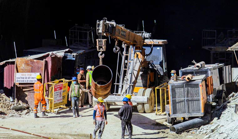 NDRF personnel and others at the under-construction tunnel between Silkyara and Dandalgaon on the Brahmakhal-Yamunotri national highway | PTI