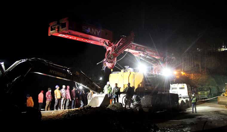 A drilling machine being brought for rescue operation at the under-construction tunnel between Silkyara and Dandalgaon on the Brahmakhal-Yamunotri national highway, in Uttarkashi district | PTI