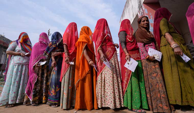 Women stand in a queue to cast their votes in Chachiyawas village, near Ajmer in Rajasthan | AP