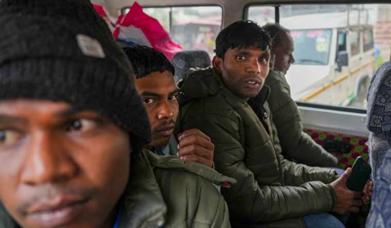 Workers from Andhra Pradesh who were rescued from the Silkyara tunnel leave for their home state after a health check-up at AIIMS, in Rishikesh | PTI