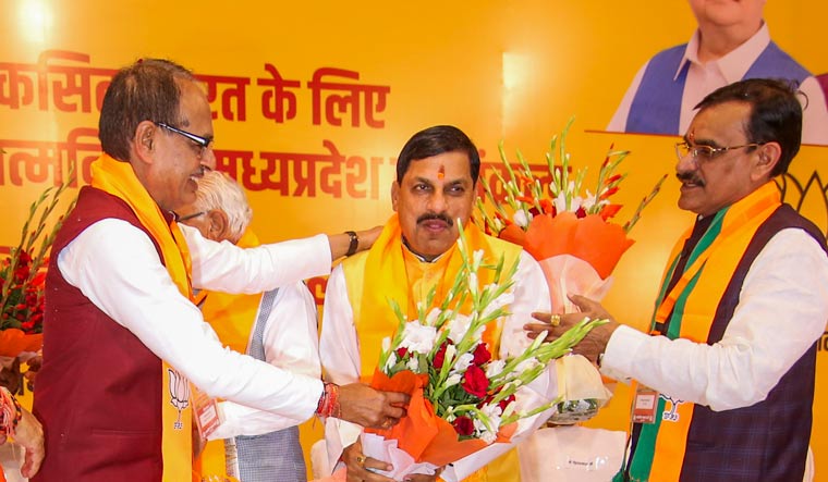 BJP MLA from Ujjain South Mohan Yadav being greeted by Madhya Pradesh CM Shivraj Singh Chouhan and state President VD Sharma | PTI