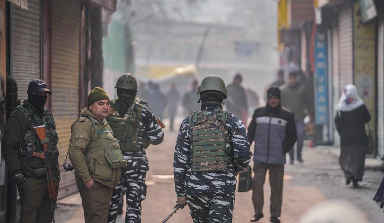 paramilitary soldiers and policemen stand guard near the main market in Srinagar on Monday | AP