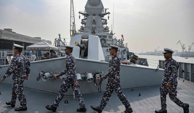 In this photograph taken on December 22, 2023, sailors walk on the deck of the INS Imphal (Yard 12706) ahead of its commissioning into the Indian Navy, at the Naval Dockyard in Mumbai | AFP