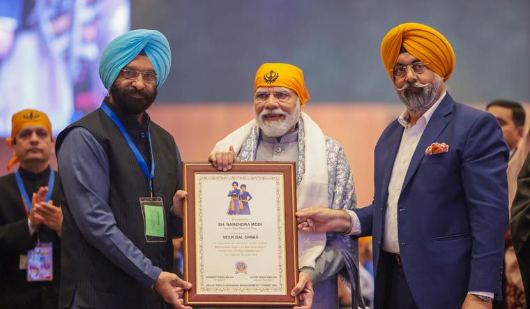  Prime Minister Narendra Modi being felicitated by the Delhi Sikh Gurdwara Management Committee (DSGMC) during a Veer Baal Diwas programme | PTI