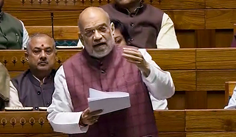 Union Home Minister Amit Shah speaks in the Lok Sabha during the Winter session of Parliament | PTI