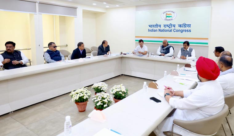 Congress president Mallikarjun Kharge with party leaders Rahul Gandhi and K.C. Venugopal addresses a review meeting on the recent assembly election results | PTI