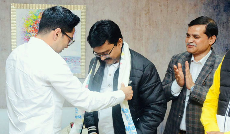 BJP MLA Suman Kanjilal being gifted TMC scarf by pary general secretary Abhishek Banerjee | PTI