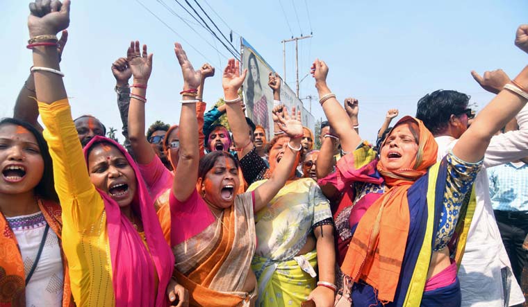 BJP supporters celebrate the party's victory at Dharmanagar in North Tripura district | PTI