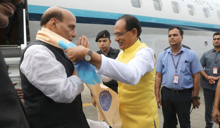 Chief Minister Shivraj Singh Chouhan receives Defence Minister Rajnath Singh in Bhopal 