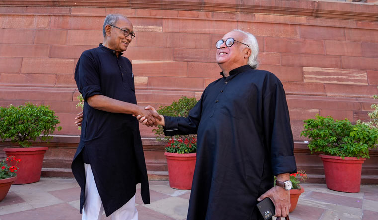 Congress MPs Digvijaya Singh and Jairam Ramesh at Parliament House complex | PTI