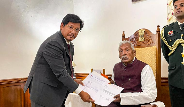 Meghalaya Governor Phagu Chauhan receives the letter of support from National People's Party (NPP) leader Conrad Sangma to form the government in Meghalaya | PTI