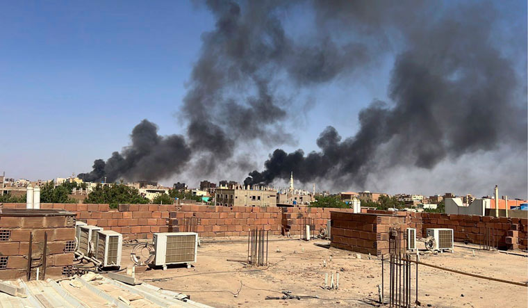 Smoke fills the sky near Doha International Hospital in Khartoum, Sudan | AP