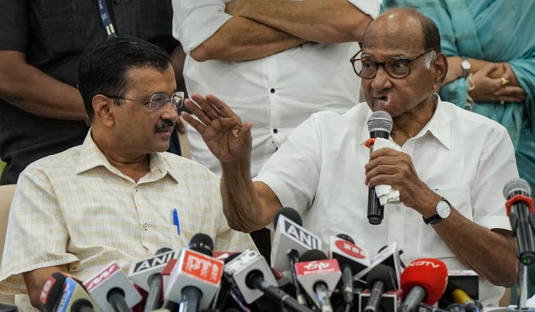 Delhi Chief Minister Arvind Kejriwal and Nationalist Congress Party chief Sharad Pawar during a press conference in Mumbai | PTI