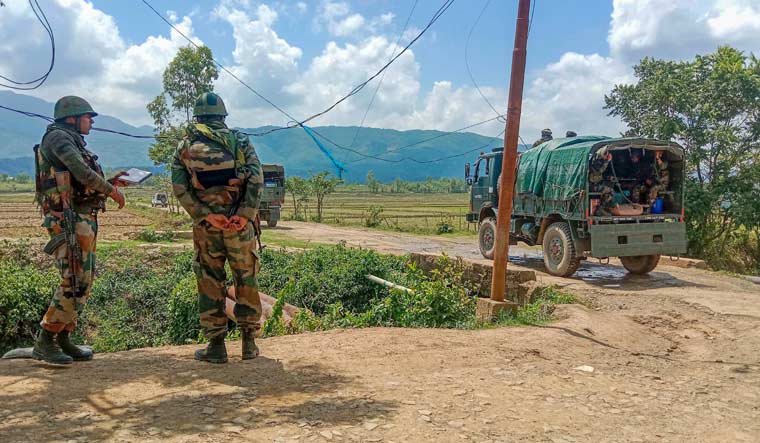 Army jawans stand guard in a violence-hit area of Manipur | PTI