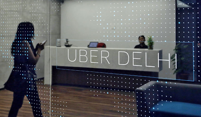 File: An employee walks inside the office of ride-hailing service Uber in Gurugram, previously known as Gurgaon, on the outskirts of New Delhi, India, April 19, 2016 | Reuters