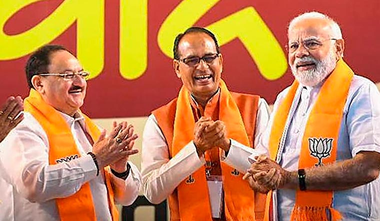 Prime Minister Narendra Modi, Madhya Pradesh CM Shivraj Singh Chouhan and BJP National President JP Nadda during an interaction programme with BJP booth workers  in Bhopal | PTI