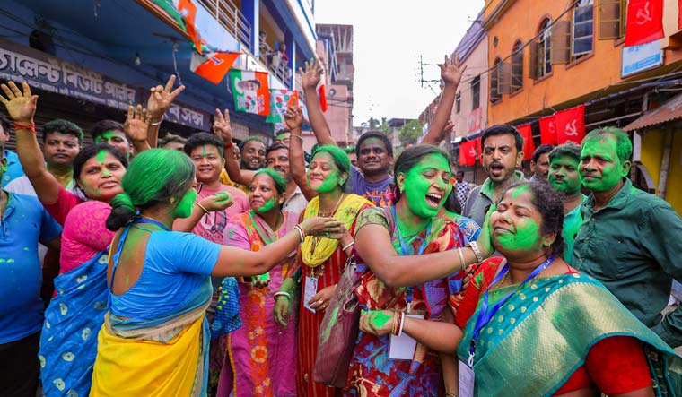 TMC supporters celebrate the party's lead during the counting of votes of West Bengal panchayat polls, in Howrah | PTI