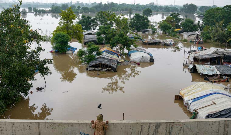 Swollen Yamuna river floods low-lying areas after heavy monsoon rain, in Delhi | PTI