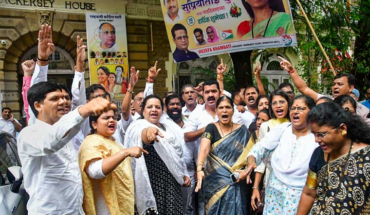 NCP supporters protest against Maharashtra Deputy Chief Minister Ajit Pawar and other party leaders who joined the state cabinet | PTI