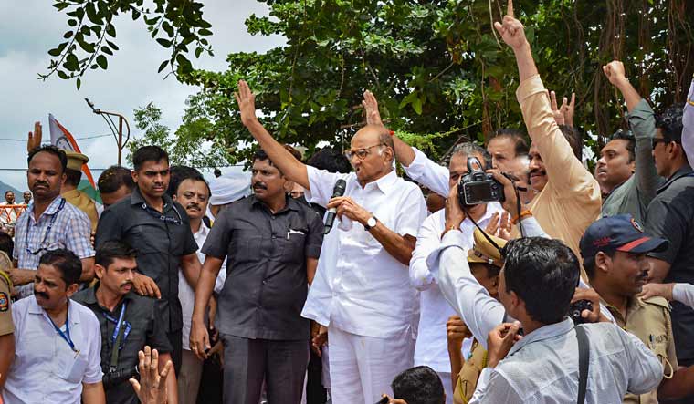 NCP Chief Sharad Pawar addresses supporters after paying tribute to former Maharashtra chief minister Yashwantrao Chavan, in Karad | PTI
