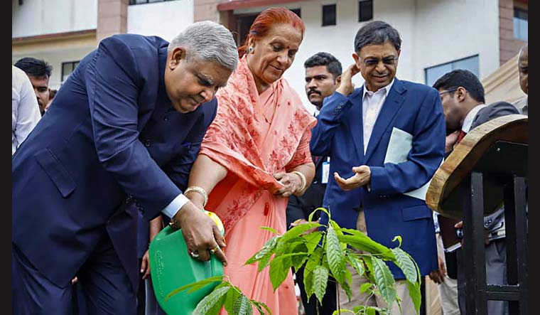Vice President Jagdeep Dhankhar with his wife Sudesh Dhankhar plants saplings of Brahma Kamal and Rudraksha at the premises of Indian Institute of Technology Guwahati | PTI