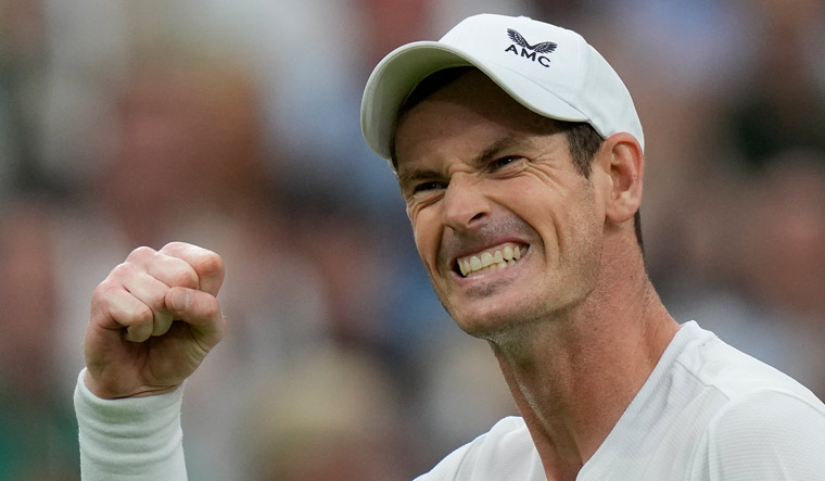 Andy Murray celebrates after beating Britain's Ryan Peniston | AP