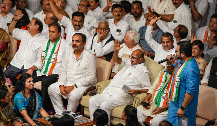 NCP chief Sharad Pawar with party leader Jayant Patil and others during a party meeting at Y B Chavan centre, in Mumbai | PTI