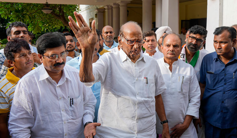 Sharad Pawar said Prime Minister Narendra Modi had spoken of massive corruption by NCP leaders, so he should punish those guilty | PTI