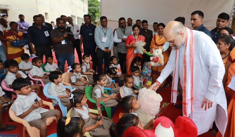 Union Home Minister Amit Shah distributes toys to children at an Anganwadi, in Gandhinagar | PTI