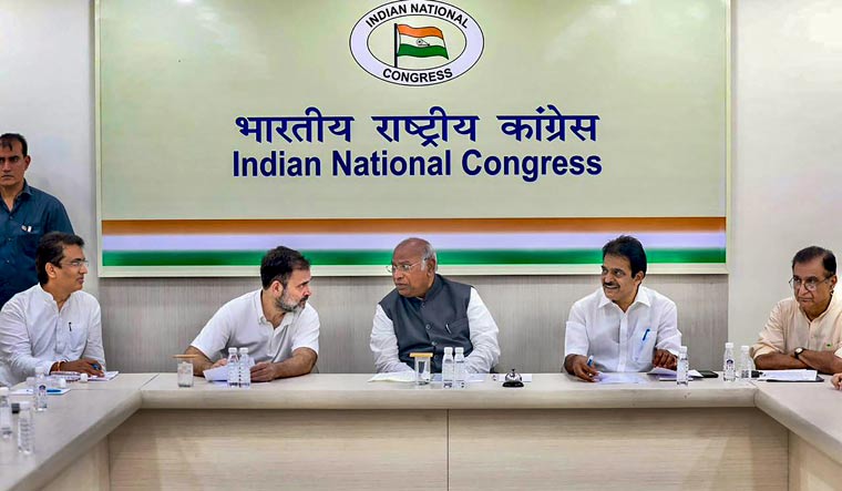 Congress President Mallikarjun Kharge with party leaders Rahul Gandhi and KC Venugopal in a meeting with Delhi Congress leaders | PTI