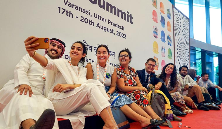 Foreign delegates click a selfie during the Y20 Summit, in Varanasi | PTI