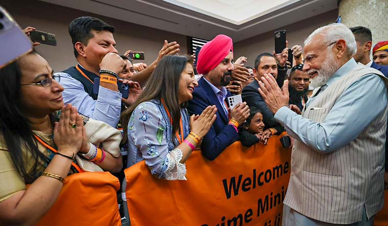 Prime Minister Narendra Modi being welcomed by the Indian community upon his arrival at Sandton Sun Hotel in Johannesburg | PTI