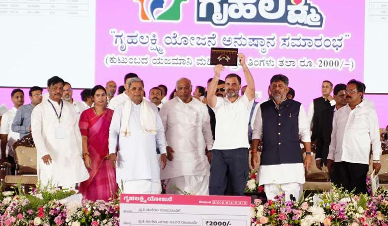 Congress MP Rahul Gandhi and party president Mallikarjun Kharge along with other leaders in Karnataka during the launch of the 'Gruha Lakshmi' scheme.