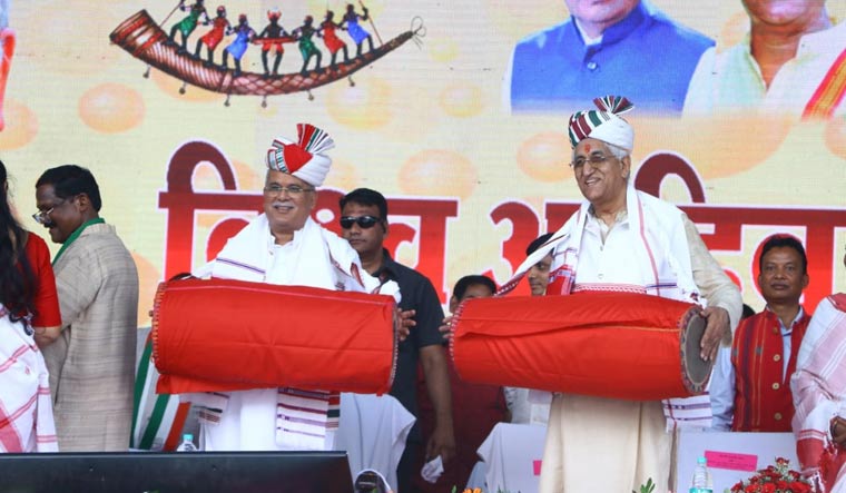 Chief Minister Bhupesh Baghel and deputy CM T.S. Singh Deo play traditional drum at Sarguja World Tribal Day event