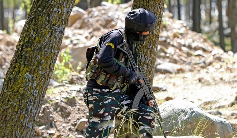 An Indian army soldier stands guard at Gadole forest. | AFP