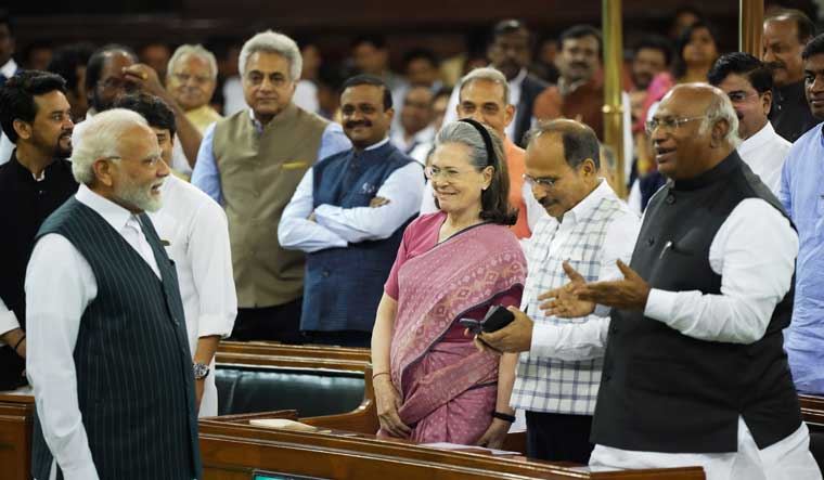 Prime Minister Narendra Modi with Leader of Opposition in the Rajya Sabha Mallikarjun Kharge, Congress MPs Adhir Ranjan Chowdhury and Sonia Gandhi and other Parliamentarians | PTI