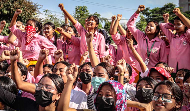 Students shout slogans during a protest against the killing of two missing students in Imphal | AFP