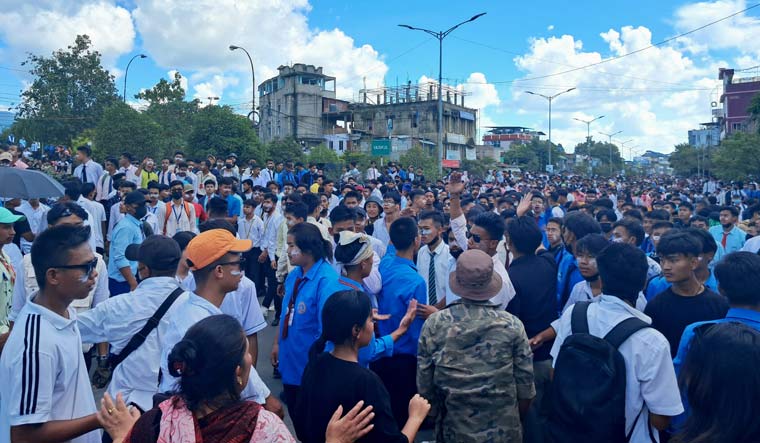 School students stage a protest rally against the killing of two Meitei students | PTI