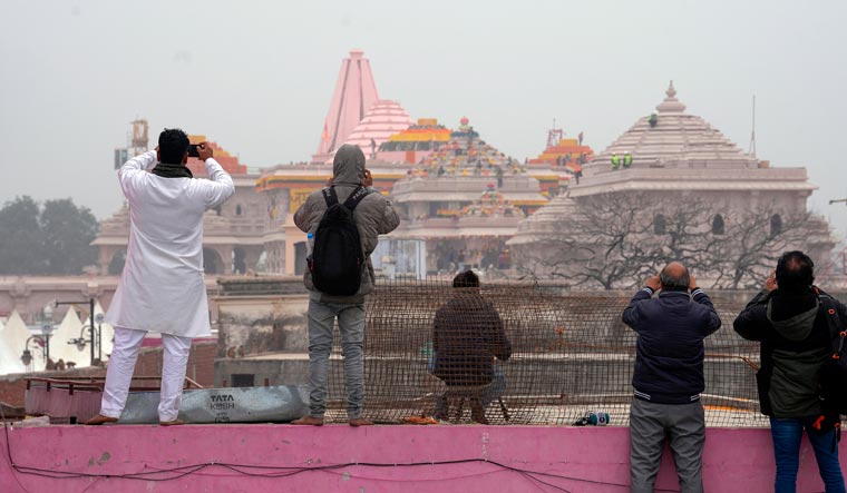 People click pictures of the premises of Ram temple, ahead of its consecration ceremony, in Ayodhya | PTI