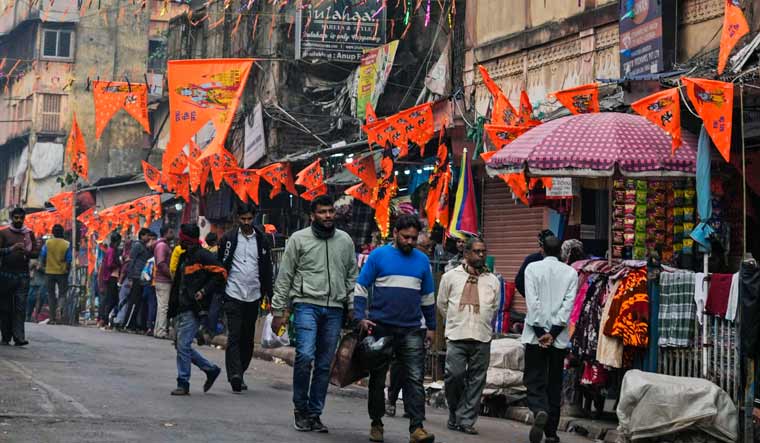 Saffron flags bearing images of the Hindu deities are displayed in a market place in Kolkata | AP