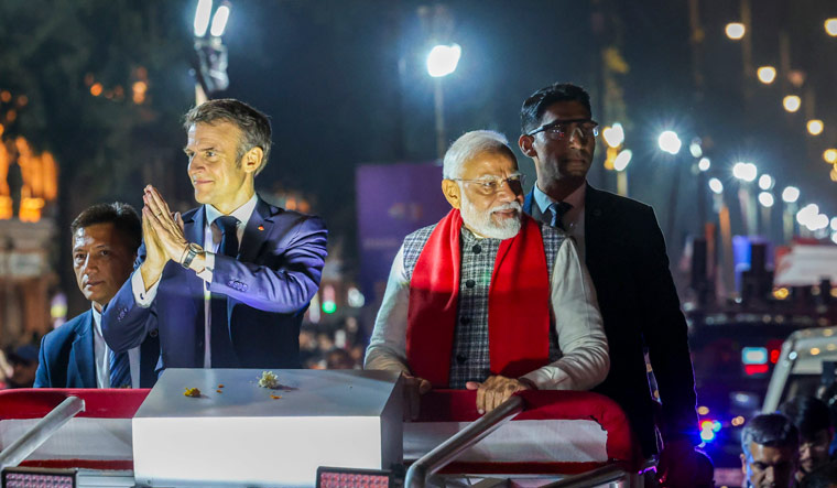 Prime Minister Narendra Modi and French President Emmanuel Macron during a roadshow in Jaipur | PTI